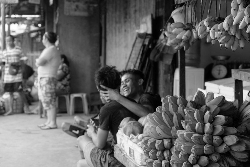 BANANA vendors at the North Public Market share a light moment as they watch over the produce they sell. These vendors are among those who rent regular stalls within the market unlike the illegal vendors who hawk on the surrounding streets.|Photo by Lourdes Rae Antenor, text by Julius D. Mariveles