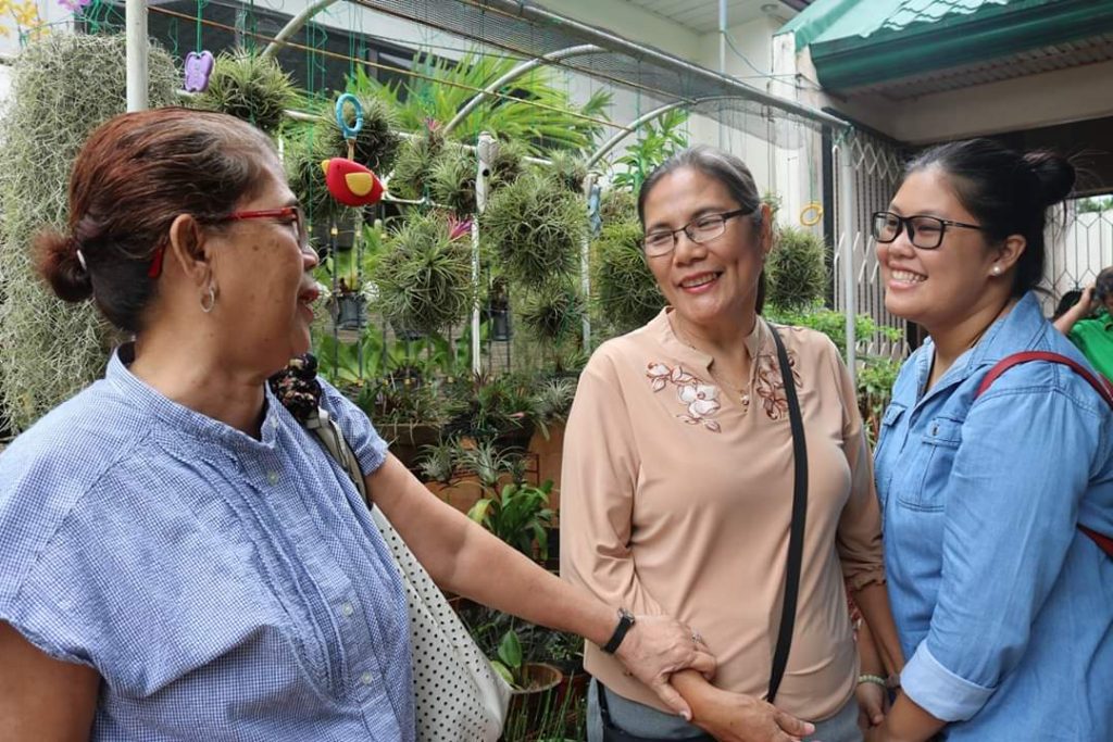 The author, right, with her grandmother, Amy, chats to a fellow Bacolodnom in Shanghai, China. | Photo from author's personal collection