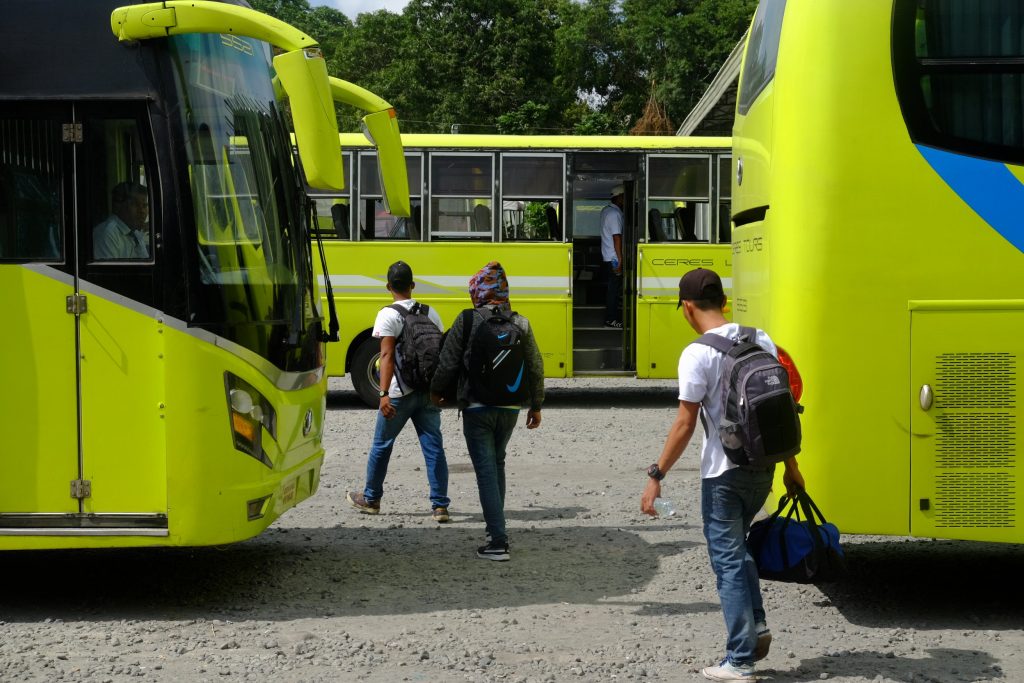 Passengers make their way to parked buses of the Ceres Liner at the southern terminal in Bacolod City. | Photo by Jose Aaron C. Abinosa