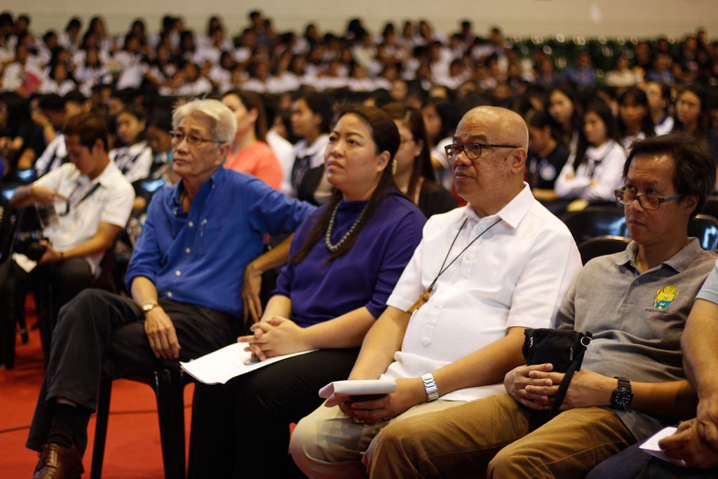 (L-R) Jose Maria Vargas of the City Disaster Risk Reduction and Management Office, Climate Change Commissioner Rachel Herrera, San Carlos Bishop Gerardo Alminaza and Social Action Center’s Chris Gonzales listen to the recorded statement of USLS President and Chancellor Joaquin Severino Martinez as he encourages the audience to act on the climate crisis.