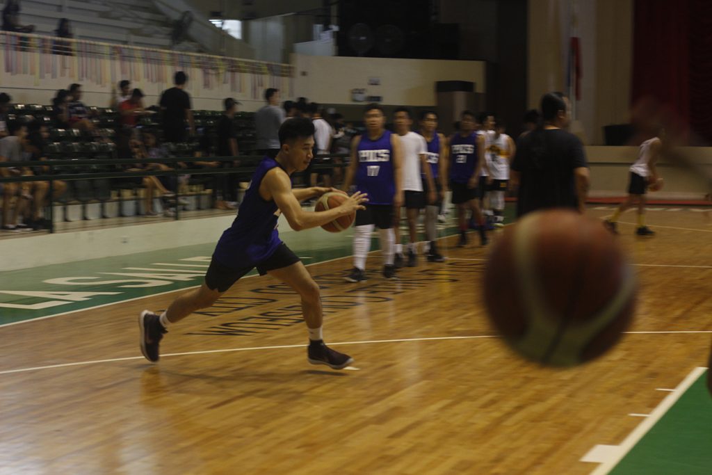 a chase and a win: u league 2019 2 Eugene Maceda (PICS 4) warms up before the start of the game.