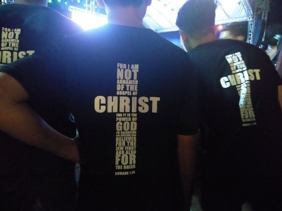 Declaration of faith. Shirts with a bible verse printed on it are being worn by the youth members. Photo by Elian Quilisadio