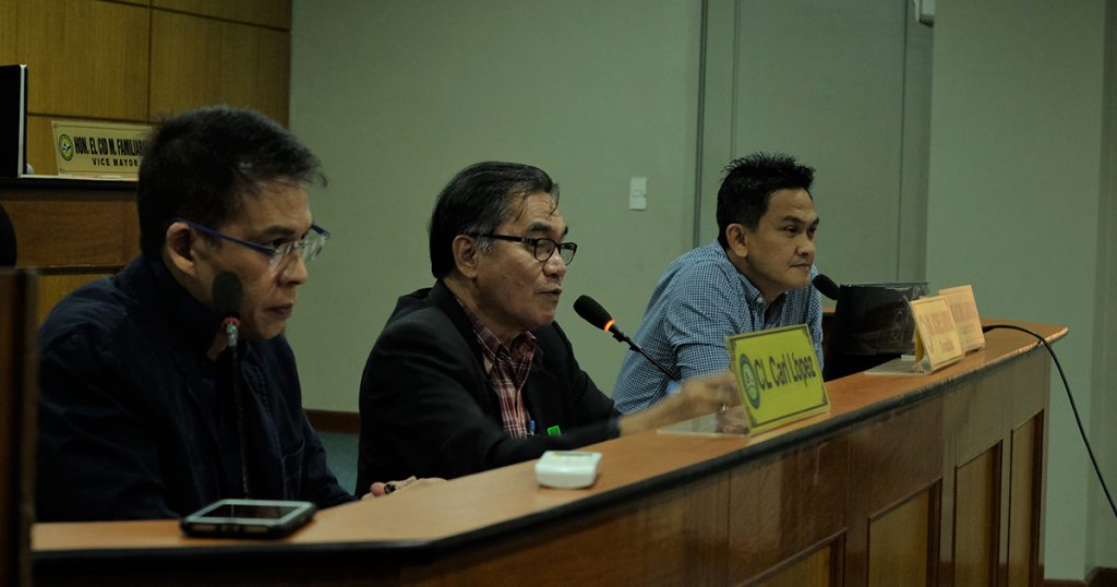 Councilor Carl Lopez, left, leads the joint committee hearing with Councilor Archie Baribar as co-chair, and lone opposition councilor Wilson Gamboa Jr. who was asked to join in. | Photo by Elian P. Quilisadio