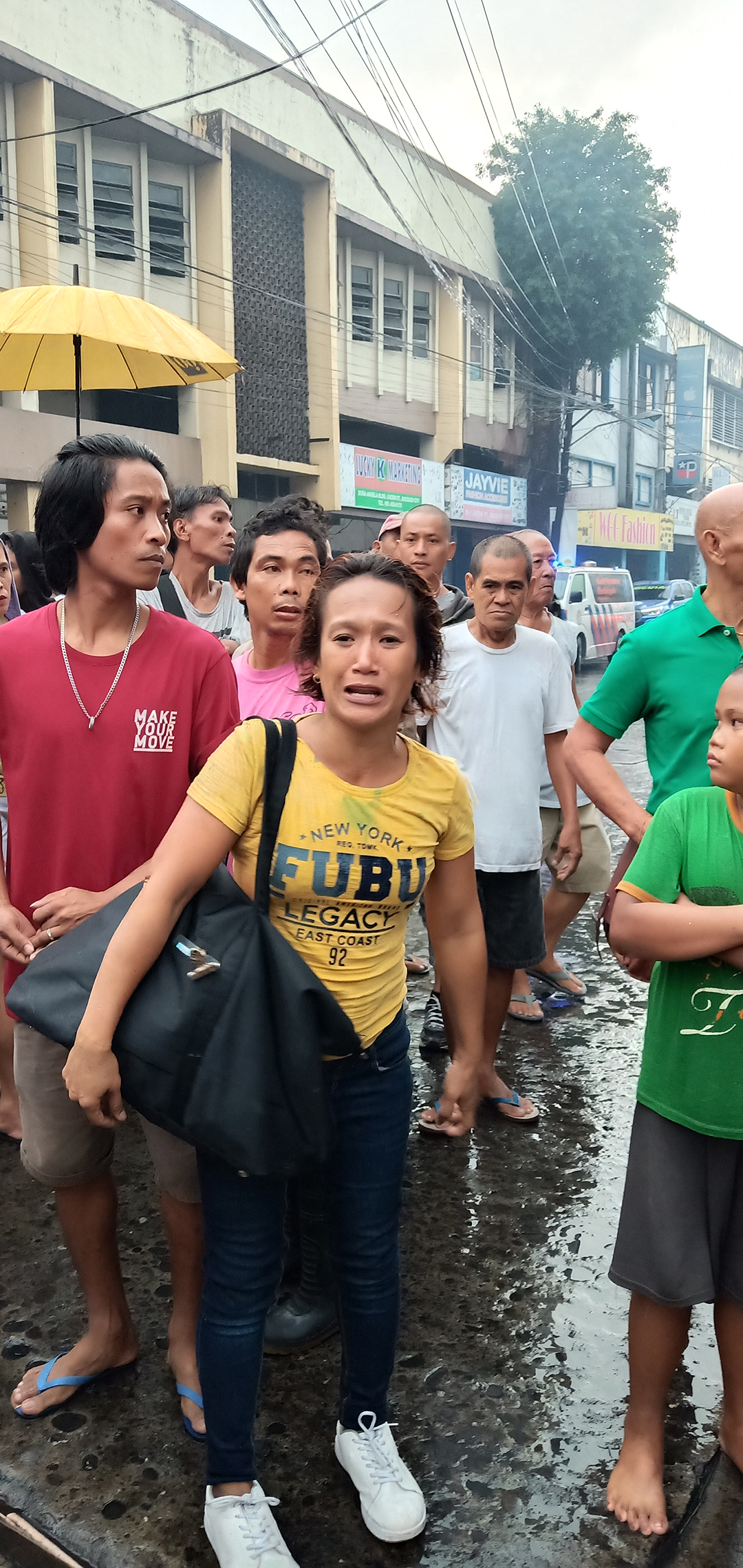 BLACK TUESDAY. A woman weeps as she learns the identities of the victims in the fire that claimed six lives including the owner of the building.