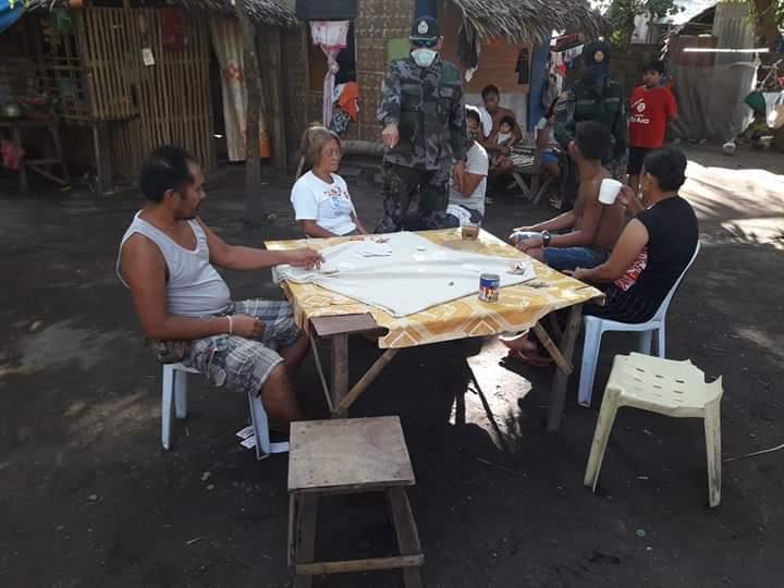 The suspects around the alleged gambling table. | Photo by BCPO