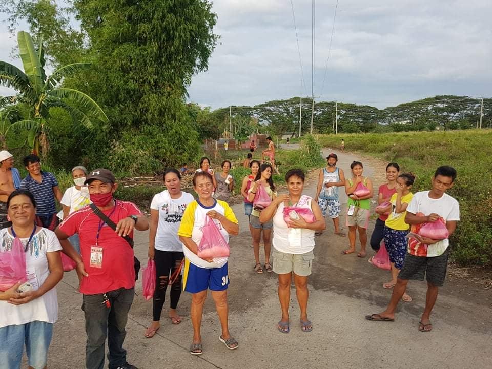 Families at Purok Paho 2, Brgy. Estefania happily receives their essential goods.
