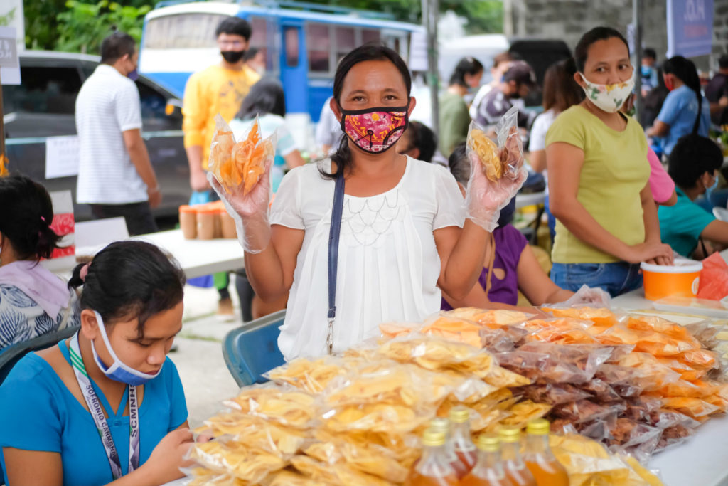 Erlinda shows off her wares, chips, which she said had been partly responsible for sending her kids to school. | Photo from NWTF