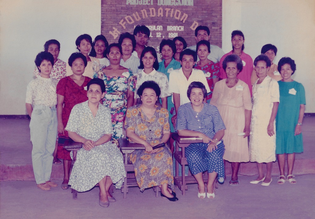 Three founders of Negros Women for Tomorrow Foundation: Suzette “Ching” Gaston, Cecilia “Cecile” del Castillo, and Corazon “Cora” Henares (sitting from Left to Right)) with Dungganon ( project of NWTF) clients during the 1st Foundation Day of Himamaylan Branch, Municipality of Himamaylan, Negros Occidental, Philippines on April 12, 1991. | Photo by NWTF